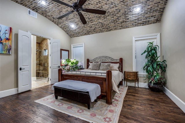 bedroom with visible vents, brick ceiling, wood finished floors, and baseboards