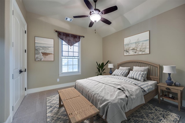 bedroom with visible vents, a ceiling fan, carpet floors, baseboards, and vaulted ceiling