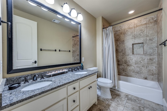 full bath featuring visible vents, toilet, shower / bath combo with shower curtain, double vanity, and a sink