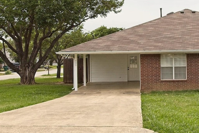 exterior space featuring a front yard, brick siding, and roof with shingles