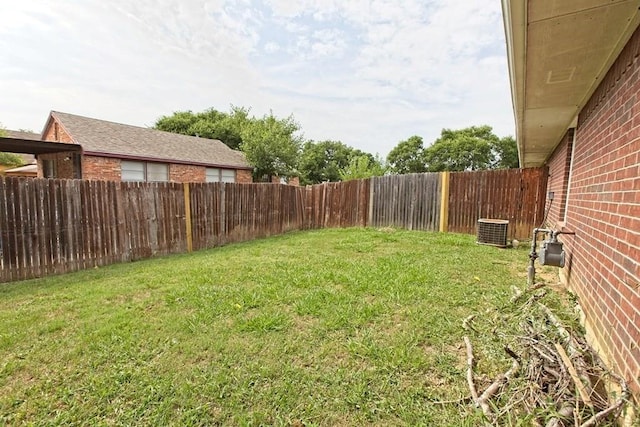 view of yard with cooling unit and a fenced backyard