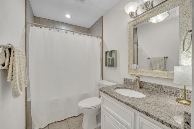 full bathroom with shower / bath combo with shower curtain, toilet, vanity, and tile patterned flooring