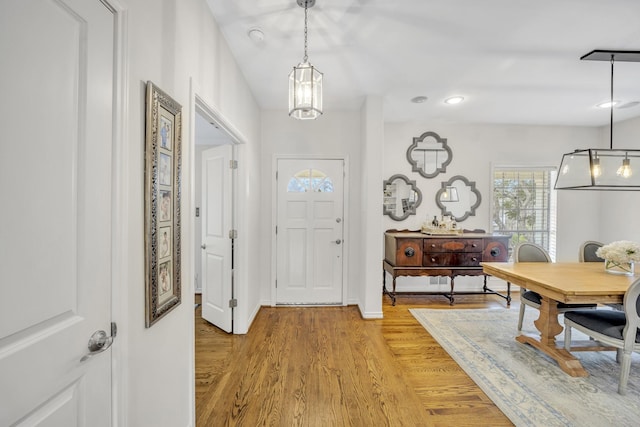 entrance foyer with recessed lighting, light wood-type flooring, and baseboards