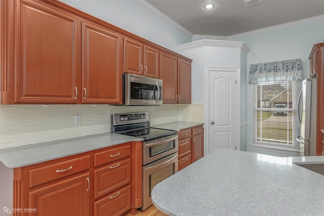 kitchen featuring visible vents, ornamental molding, light stone counters, stainless steel appliances, and decorative backsplash