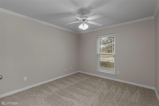 carpeted spare room featuring baseboards, ceiling fan, and ornamental molding