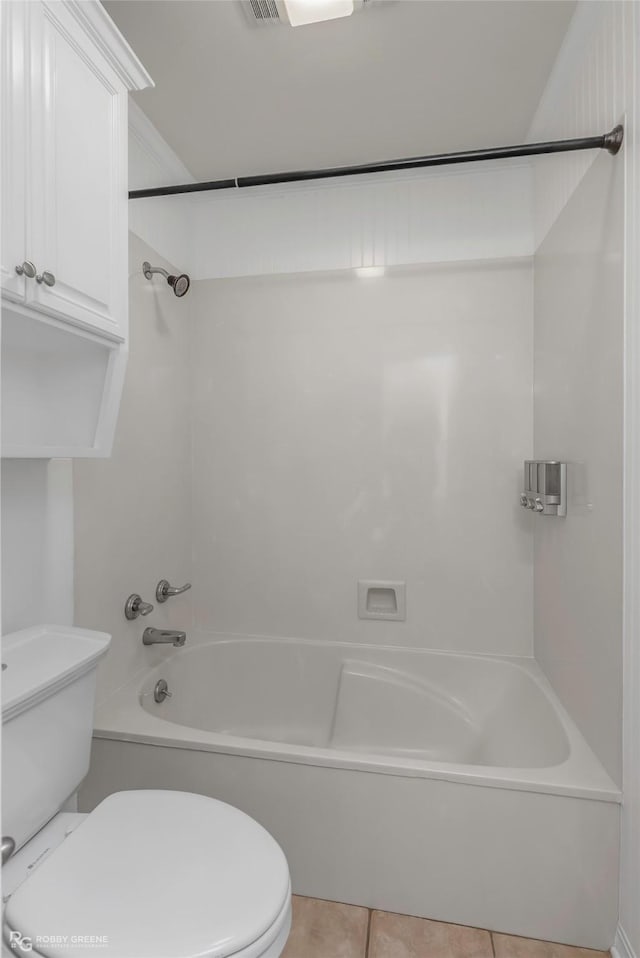 full bathroom with  shower combination, toilet, and tile patterned floors