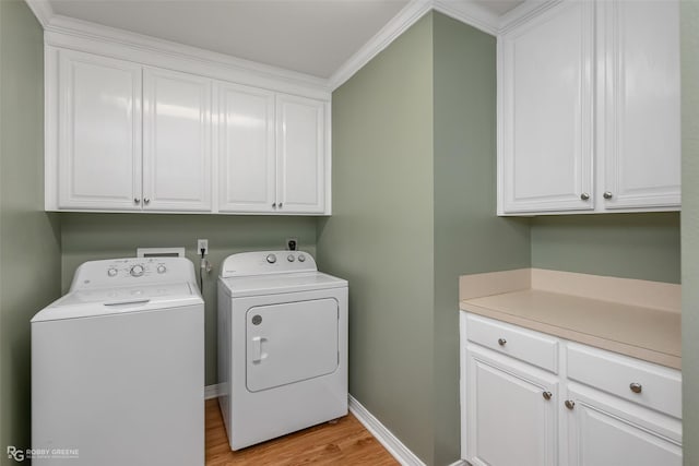 clothes washing area featuring baseboards, light wood-type flooring, cabinet space, and independent washer and dryer