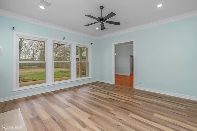 empty room with light wood-type flooring, visible vents, recessed lighting, crown molding, and baseboards