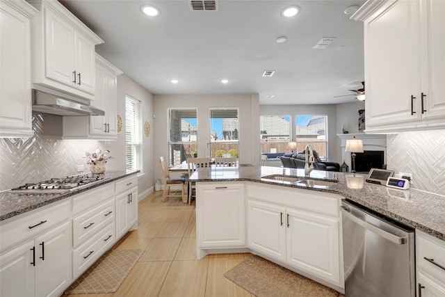 kitchen featuring visible vents, under cabinet range hood, recessed lighting, appliances with stainless steel finishes, and a sink