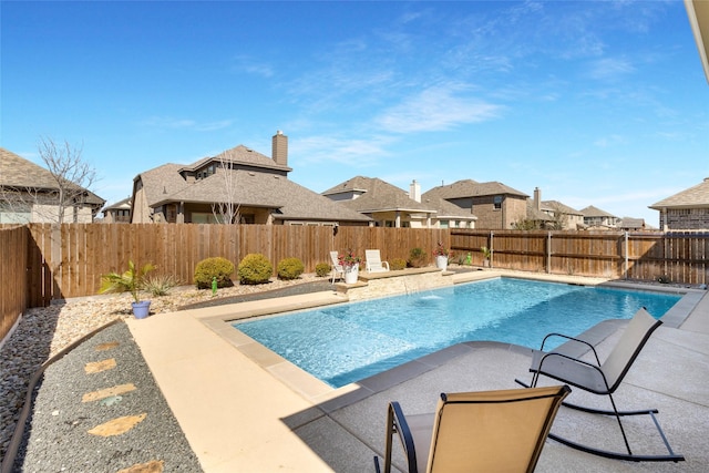 view of pool featuring a patio area, a fenced in pool, and a fenced backyard