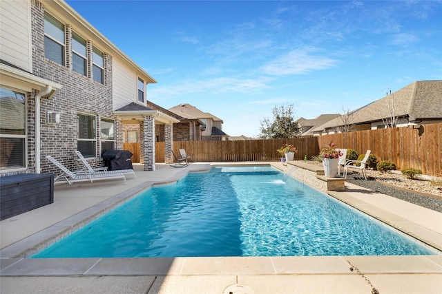 view of pool featuring a patio area, a fenced in pool, and a fenced backyard