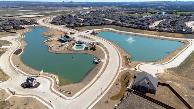 aerial view featuring a residential view and a water view