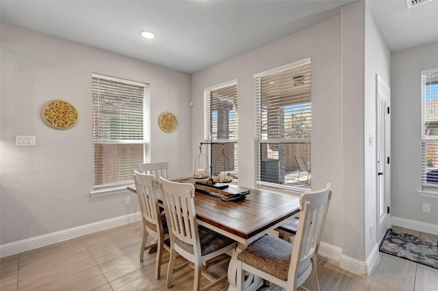 dining area with visible vents and baseboards