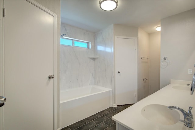 bathroom with double vanity, shower / bath combination, and a sink