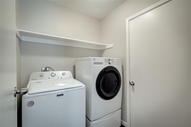 clothes washing area with laundry area and separate washer and dryer