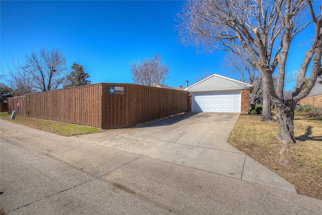 view of property exterior featuring a garage, fence, and brick siding