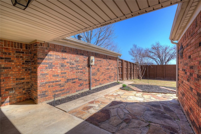 view of patio featuring fence