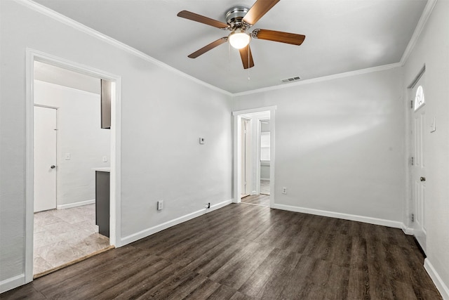 unfurnished room with wood finished floors, baseboards, and ornamental molding