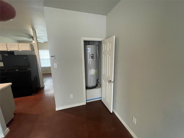 corridor featuring electric water heater and baseboards