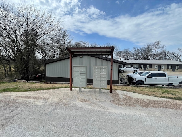 view of outbuilding featuring a carport