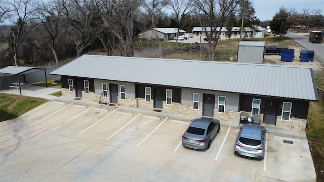 view of building exterior featuring uncovered parking