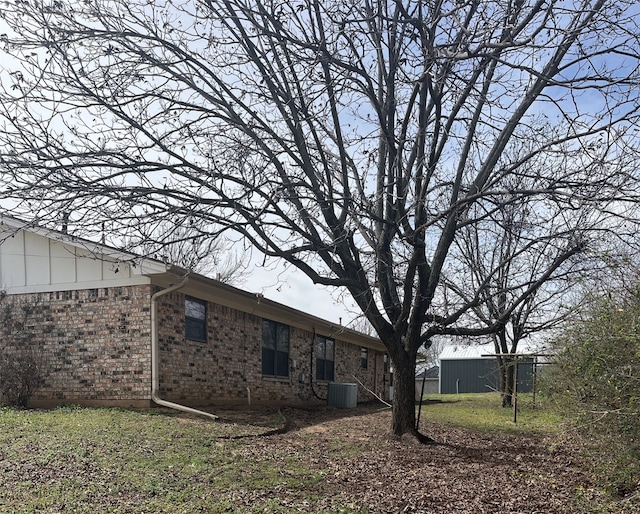 back of house with brick siding