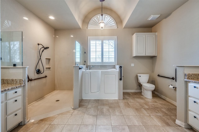 bathroom with toilet, tile patterned flooring, baseboards, a bath, and vanity