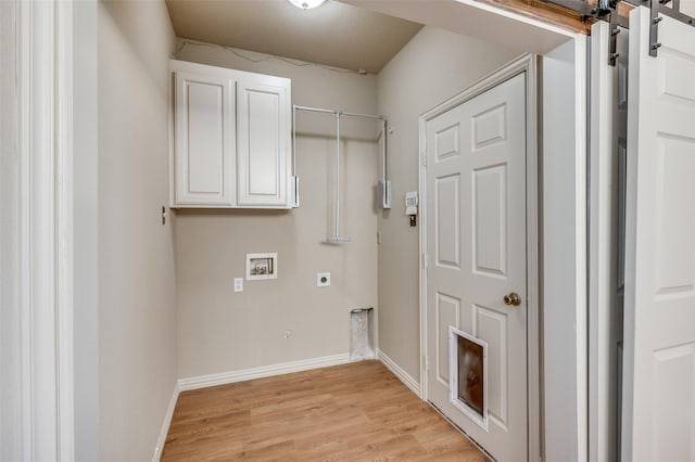 laundry area featuring washer hookup, light wood-style flooring, cabinet space, baseboards, and hookup for an electric dryer