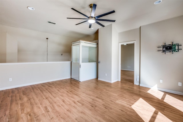 unfurnished room with visible vents, baseboards, a ceiling fan, and light wood finished floors