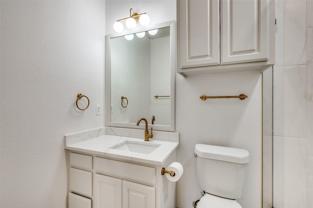 bathroom with toilet and vanity