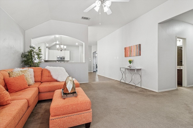 carpeted living area with baseboards, visible vents, high vaulted ceiling, arched walkways, and ceiling fan with notable chandelier