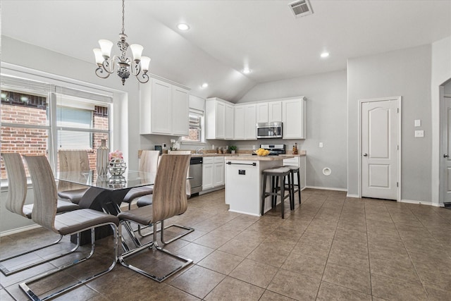 kitchen featuring white cabinetry, light countertops, visible vents, and stainless steel appliances