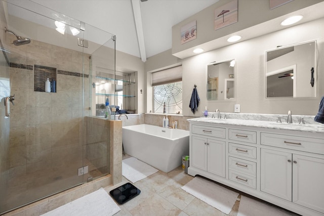 full bath featuring double vanity, a soaking tub, a shower stall, and a sink