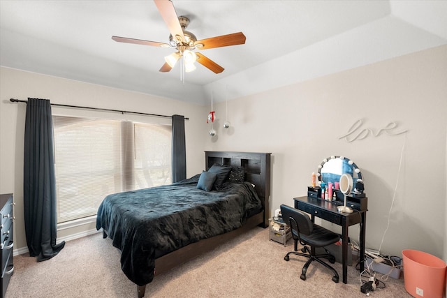 carpeted bedroom with baseboards and a ceiling fan