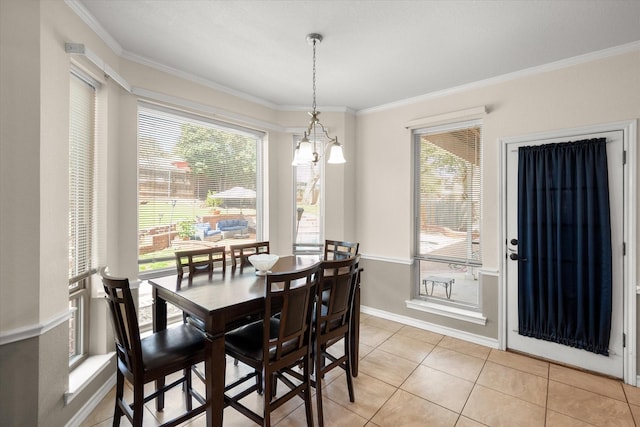 dining area featuring crown molding, light tile patterned floors, and baseboards