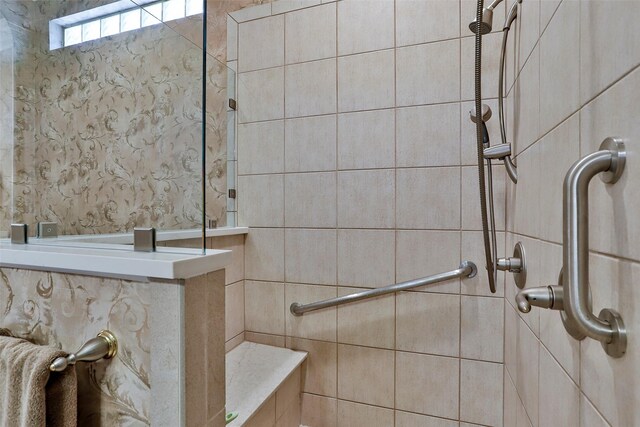 full bath featuring tiled shower