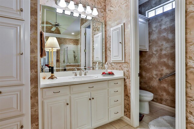 full bath featuring wallpapered walls, tile patterned floors, toilet, and vanity