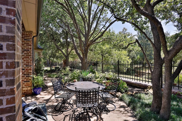 view of patio / terrace with outdoor dining space and fence