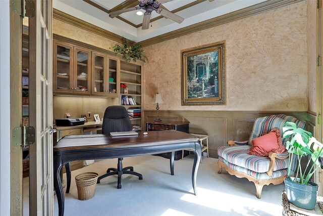 home office with ornamental molding, carpet, wainscoting, a decorative wall, and ceiling fan