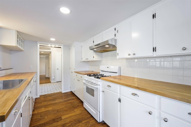 kitchen with gas range gas stove, under cabinet range hood, dark wood-style floors, wood counters, and a sink