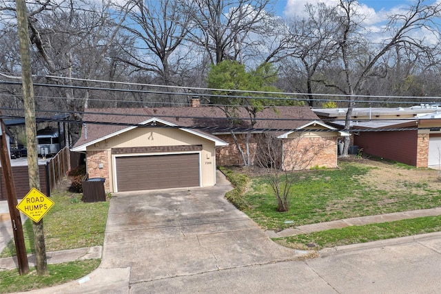 ranch-style house with brick siding, driveway, and a front lawn