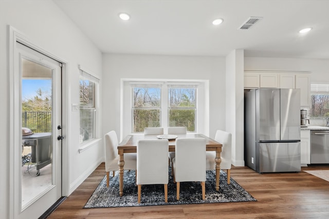 dining area featuring visible vents, recessed lighting, baseboards, and wood finished floors