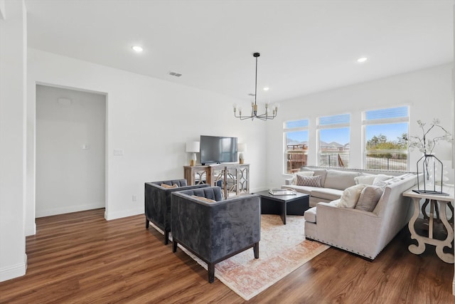 living room featuring recessed lighting, visible vents, a notable chandelier, and wood finished floors