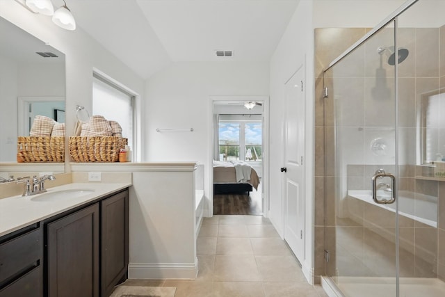 ensuite bathroom with visible vents, connected bathroom, vaulted ceiling, tile patterned floors, and vanity