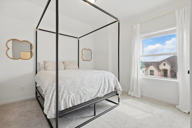 bedroom featuring baseboards and carpet floors