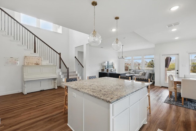 kitchen with a wealth of natural light, visible vents, and dark wood-style flooring