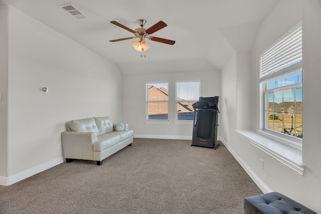 sitting room featuring vaulted ceiling, visible vents, plenty of natural light, and carpet floors