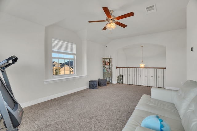 living room with vaulted ceiling, baseboards, visible vents, and carpet floors