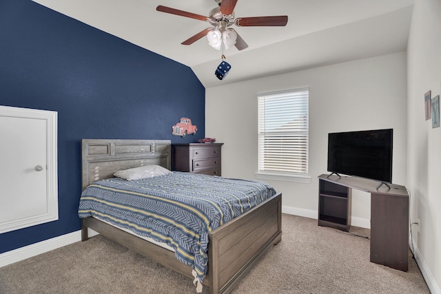 bedroom with lofted ceiling, a ceiling fan, baseboards, and carpet floors