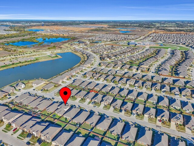 birds eye view of property featuring a residential view and a water view